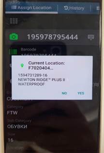 A phone with a white paper on it
Description automatically generated